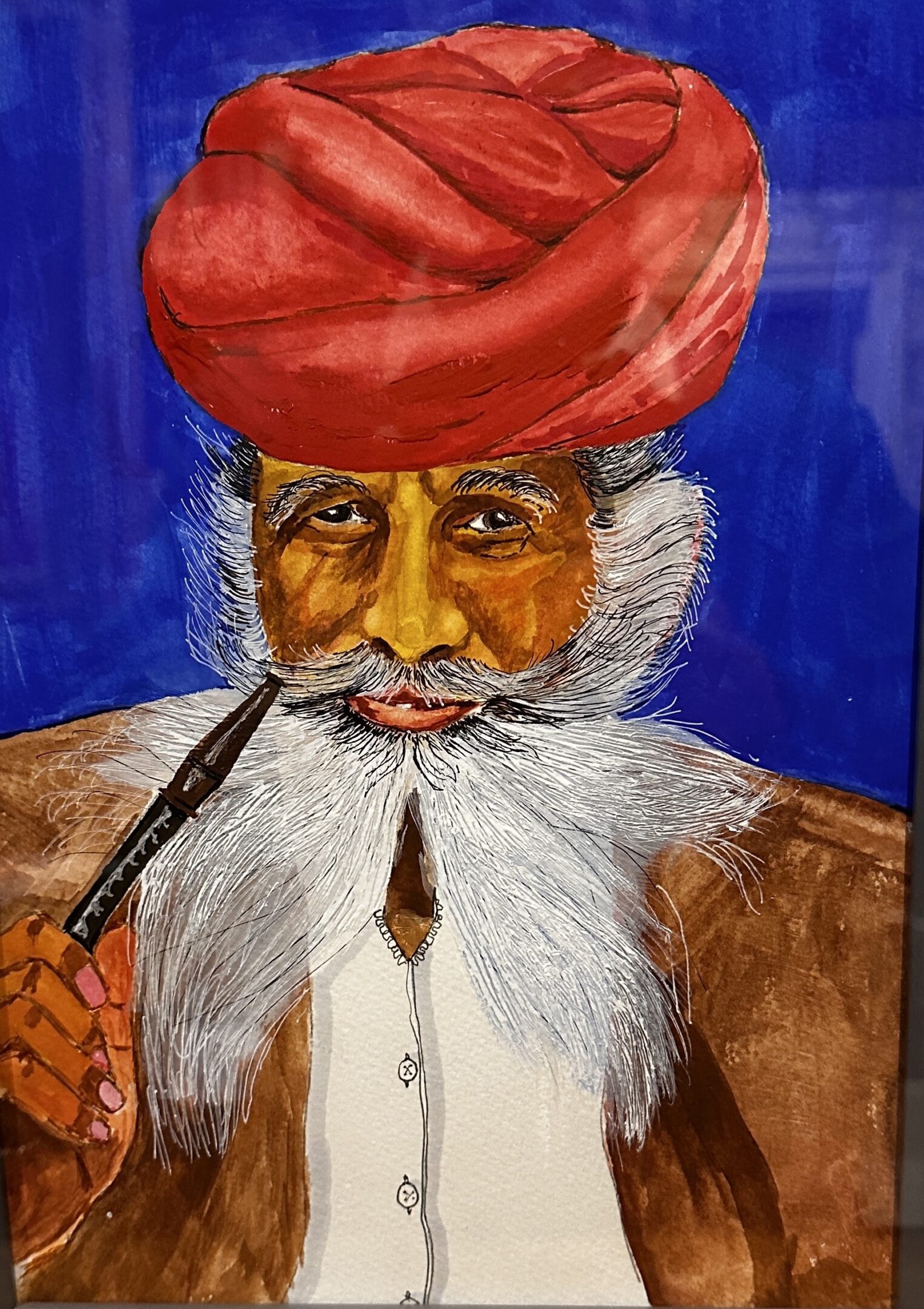 Portrait of an elderly man with a white beard and red turban, smoking a pipe.