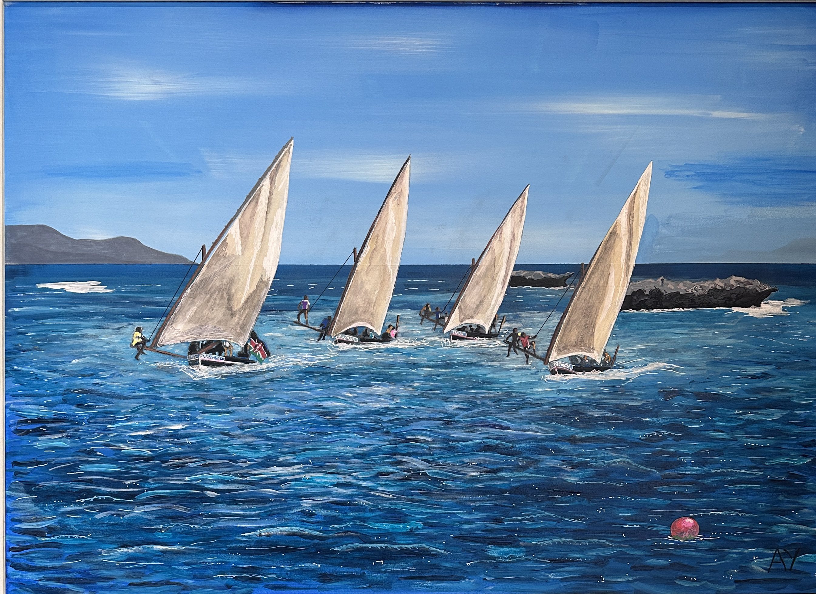 Four sailboats glide across blue water under a clear sky.