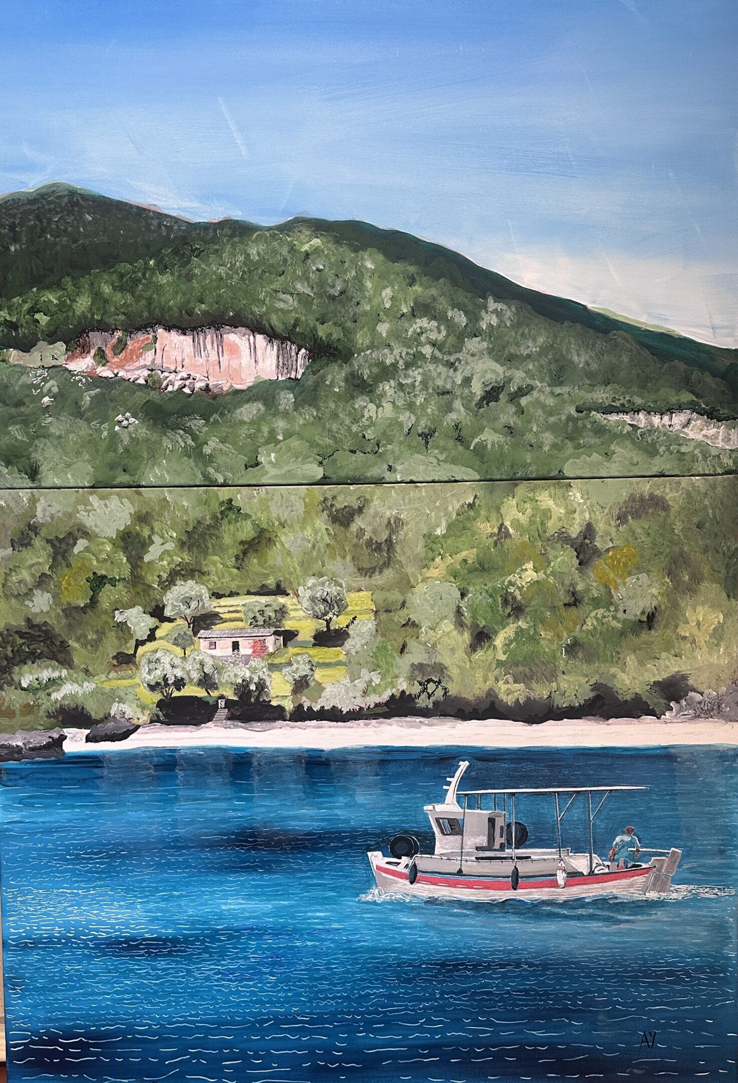 A boat sails near a forested shoreline with hills in the background.