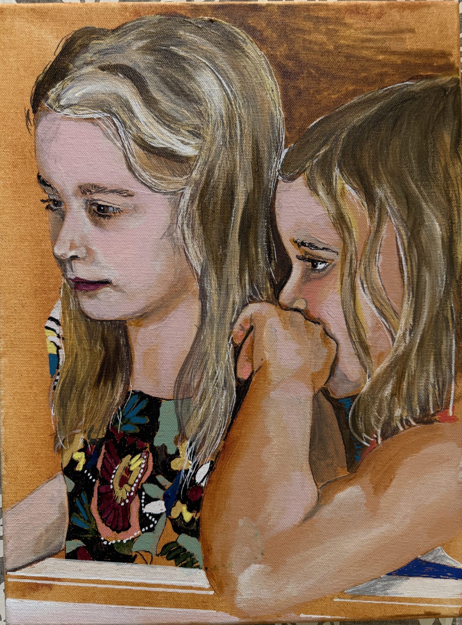 Two young girls with thoughtful expressions in a close-up portrait.