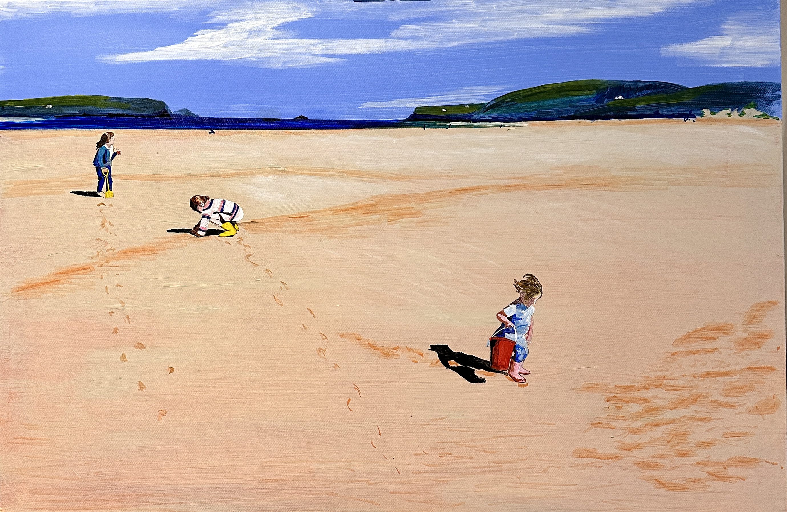 Child walking on a vast sandy beach with a dog.