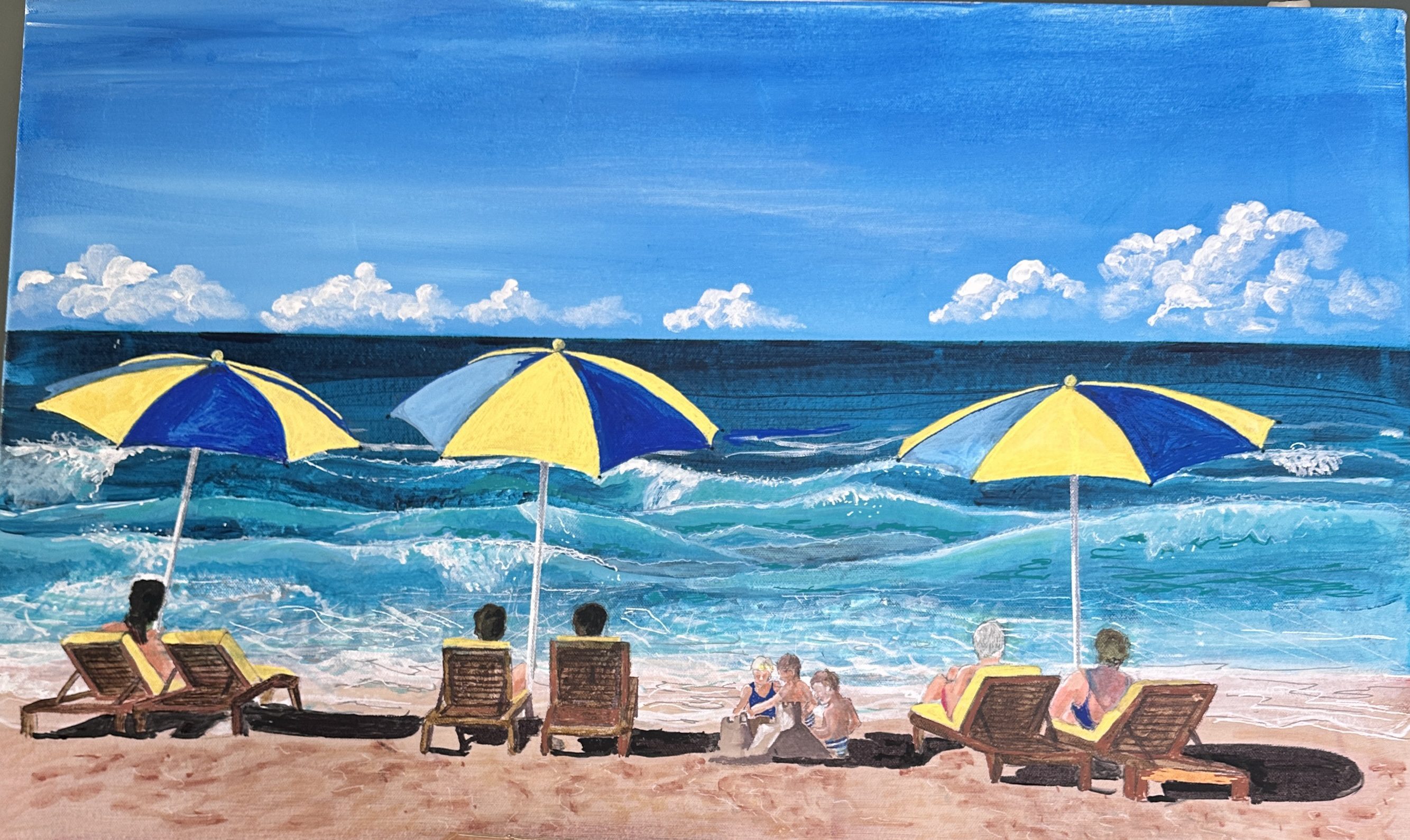 Four people relaxing under yellow and blue umbrellas on a sunny beach.