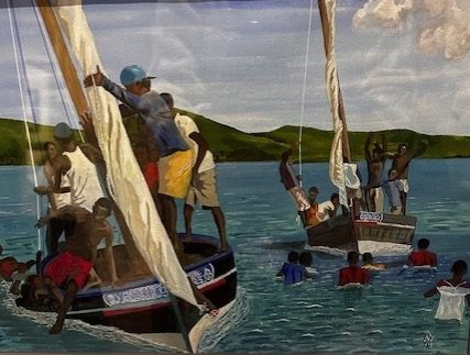 People on boats with sails enjoying a sunny day on the water.